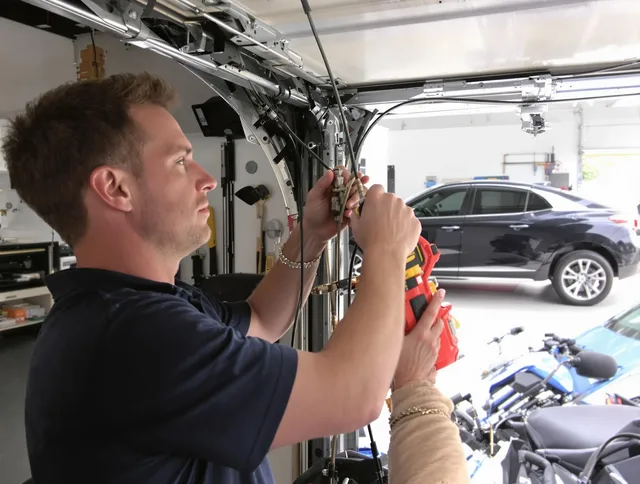 Daytona Beach Garage Door Repair safety certified technician performing cable replacement in Daytona Beach