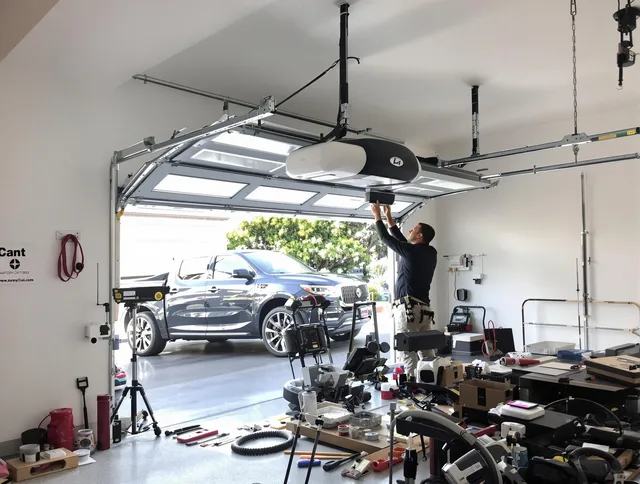 Daytona Beach Garage Door Repair specialist installing smart garage door opener system in Daytona Beach home